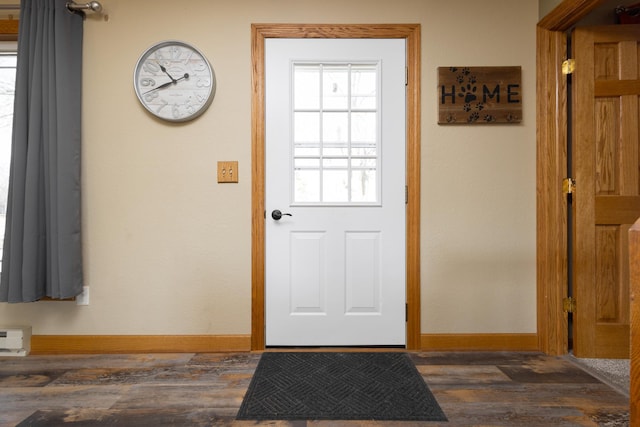 doorway to outside with dark hardwood / wood-style floors