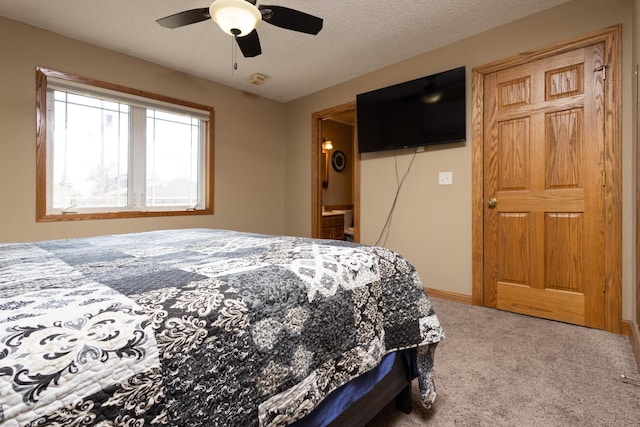 bedroom featuring ceiling fan, a textured ceiling, and carpet flooring