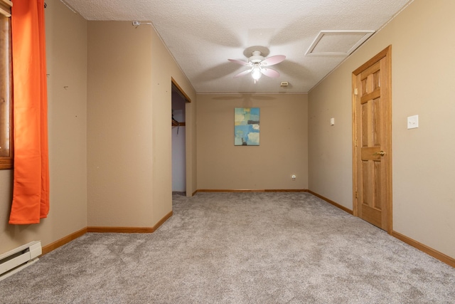 carpeted empty room with a baseboard radiator, ceiling fan, and a textured ceiling