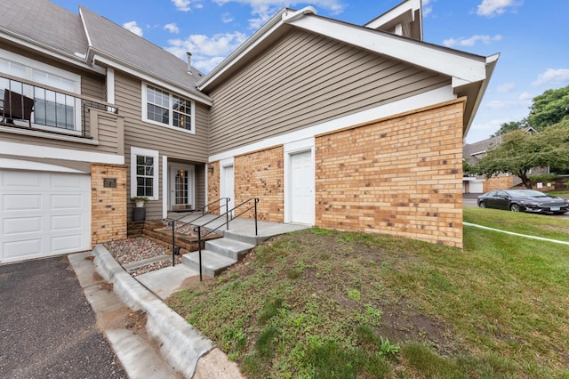 view of front of house with a garage and a front yard