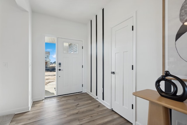 entryway with light hardwood / wood-style floors