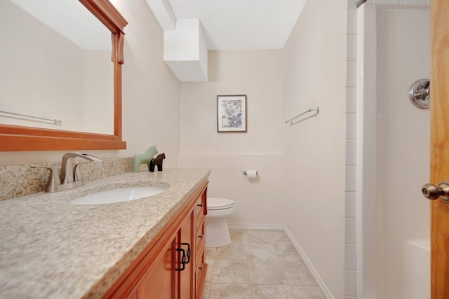 bathroom with vanity, toilet, a textured ceiling, and a shower