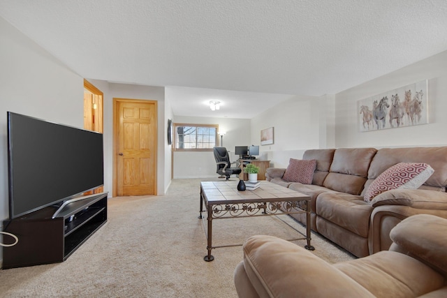 carpeted living room featuring a textured ceiling