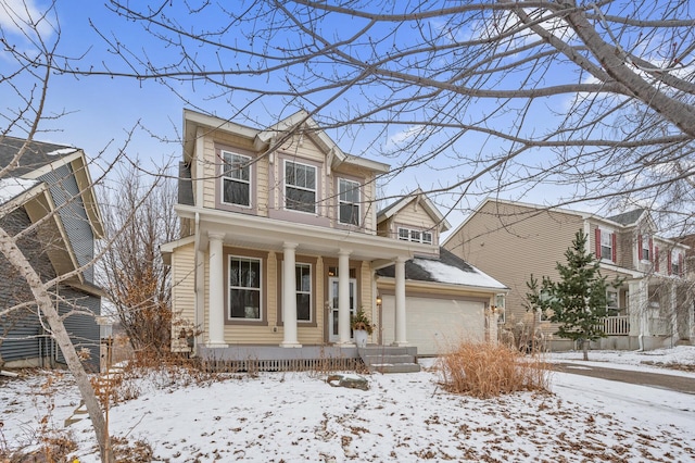 view of front of house featuring a garage and covered porch