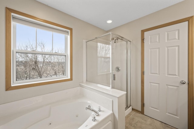 bathroom with shower with separate bathtub