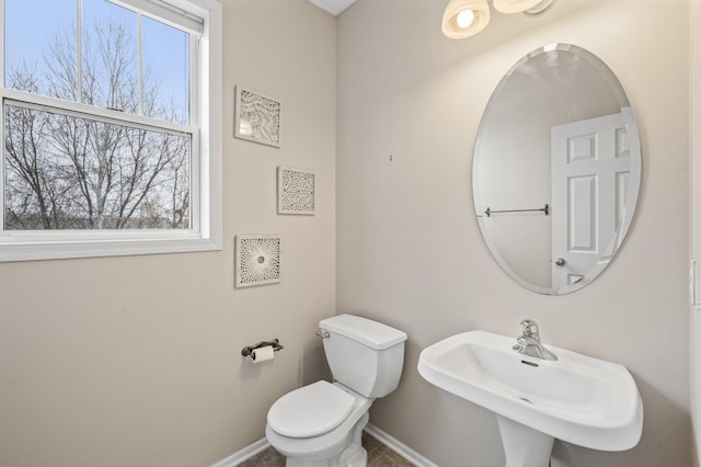 bathroom featuring sink and toilet