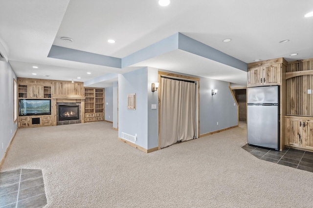 unfurnished living room with dark colored carpet