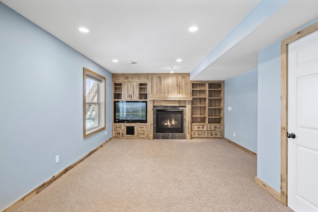 unfurnished living room featuring built in features and light colored carpet