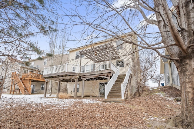 snow covered property with a wooden deck