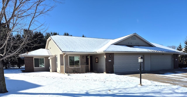 ranch-style house with a garage and covered porch