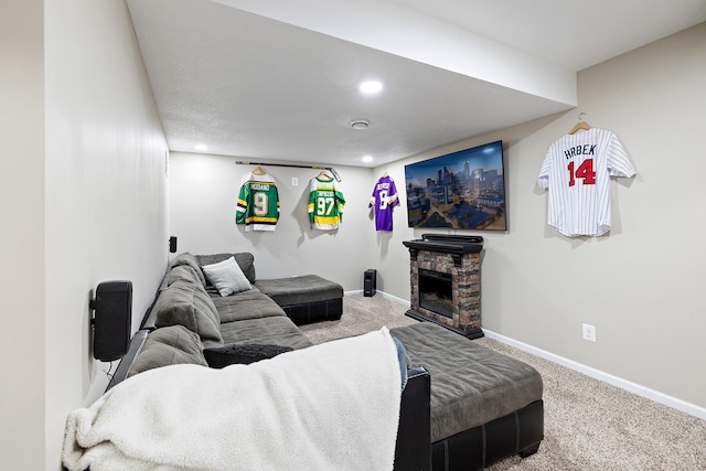 living room featuring a fireplace, baseboards, carpet flooring, and recessed lighting