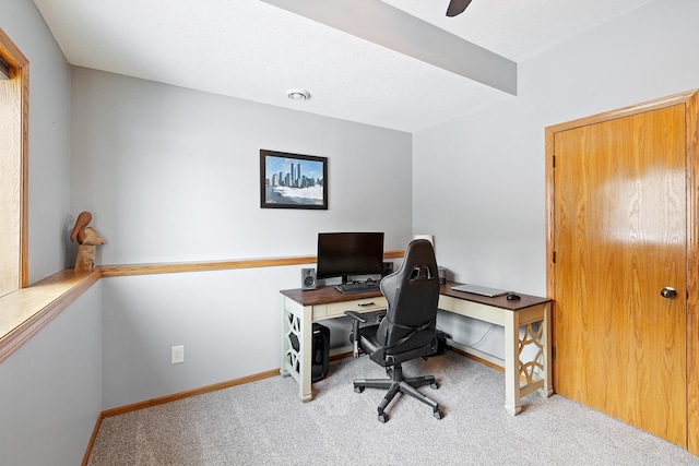 office featuring light colored carpet, visible vents, and baseboards