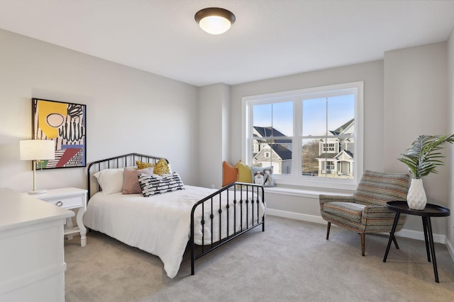 bedroom featuring light carpet