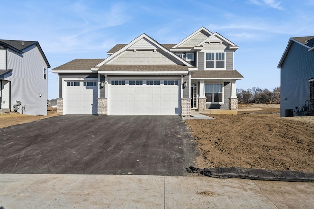 craftsman house featuring a garage