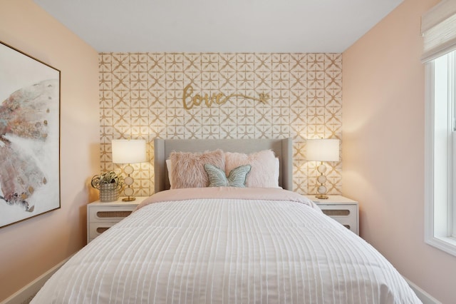 bedroom featuring baseboards