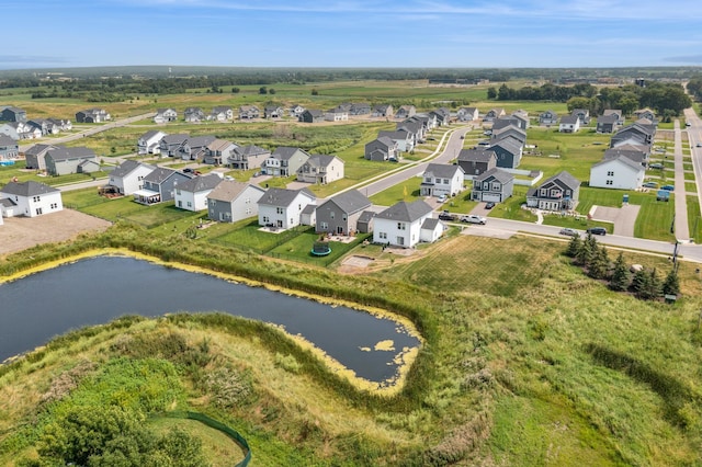 bird's eye view with a residential view and a water view