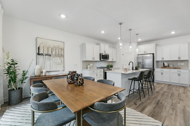 dining room featuring light hardwood / wood-style flooring