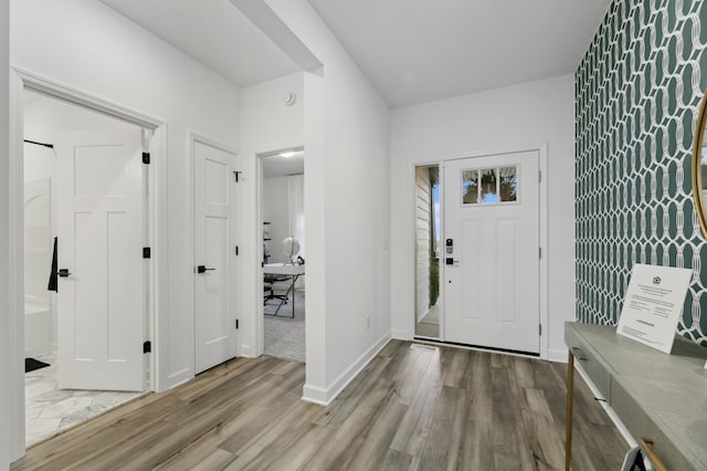 entryway with light hardwood / wood-style floors