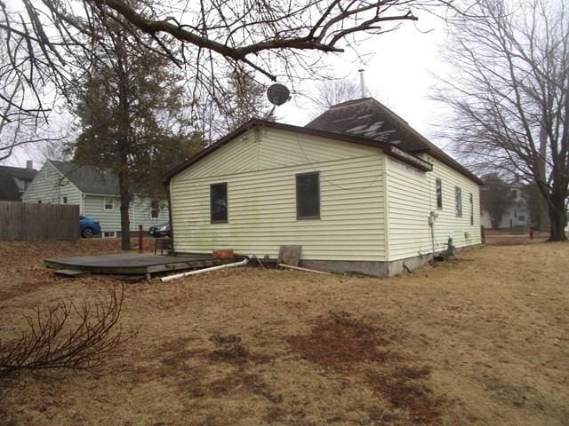 view of home's exterior with a wooden deck