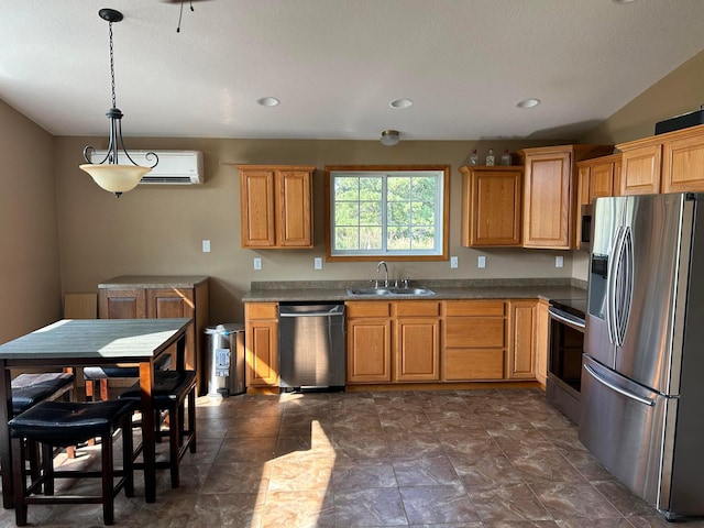 kitchen with appliances with stainless steel finishes, lofted ceiling, sink, a wall mounted AC, and hanging light fixtures