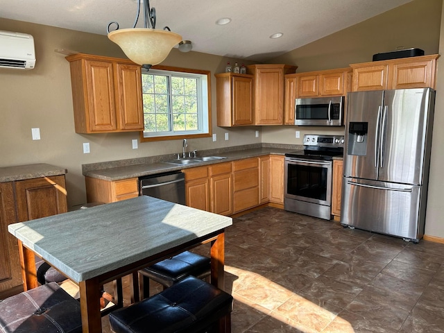 kitchen with lofted ceiling, sink, hanging light fixtures, an AC wall unit, and appliances with stainless steel finishes