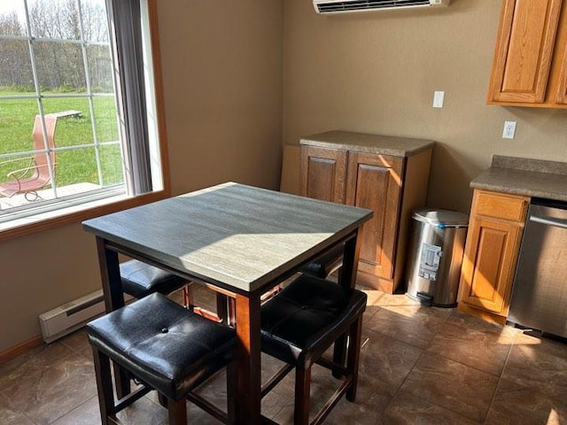 dining room featuring a baseboard radiator and a wall unit AC