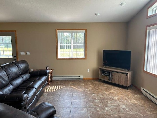 living room with a baseboard radiator and light tile patterned flooring