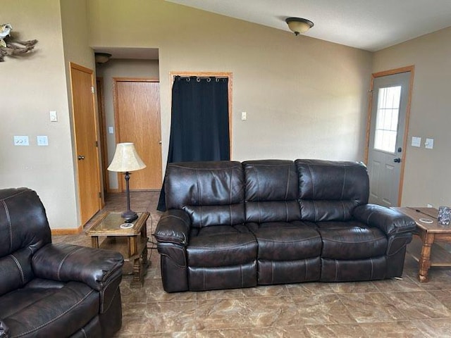 living room featuring vaulted ceiling