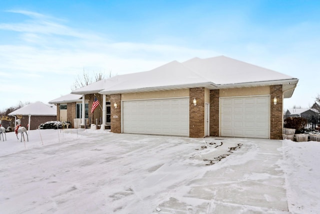 ranch-style home featuring a garage