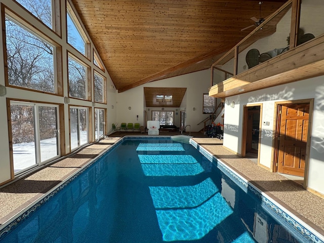 indoor pool featuring ceiling fan