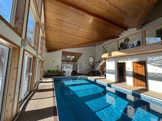 indoor pool featuring a ceiling fan