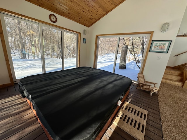 bedroom featuring lofted ceiling, access to exterior, and wood ceiling