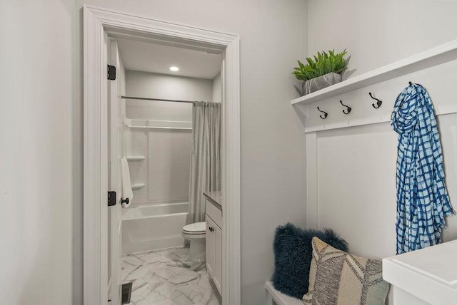 full bathroom featuring vanity, shower / bath combination with curtain, and toilet