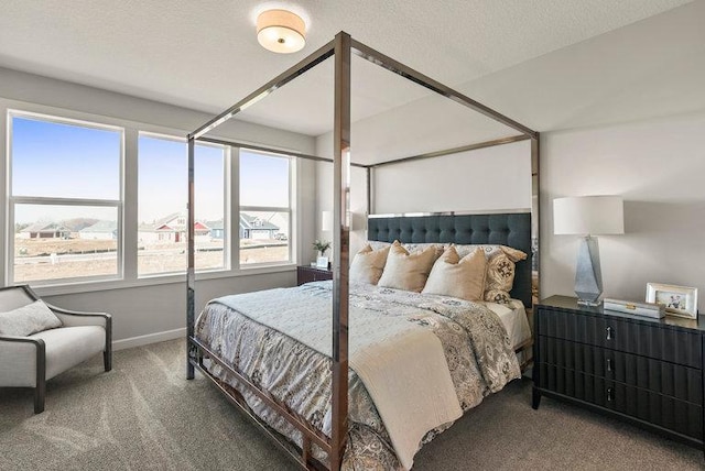 carpeted bedroom featuring a textured ceiling