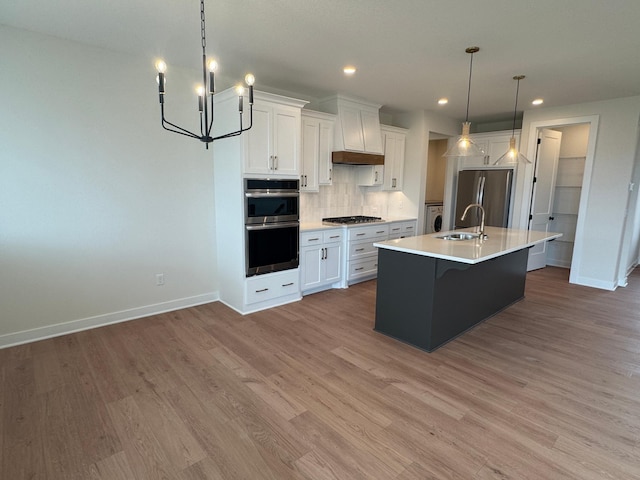 14514 Kingsview Ln, Dayton, MN 55327 - kitchen with appliances with stainless steel finishes, a sink, baseboards, custom exhaust hood, and an inviting chandelier