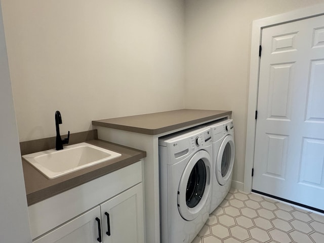 14514 Kingsview Ln, Dayton, MN 55327 - laundry room featuring cabinet space, washing machine and dryer, and a sink