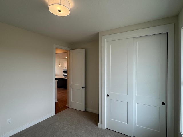 14514 Kingsview Ln, Dayton, MN 55327 - unfurnished bedroom featuring baseboards, carpet, and a closet