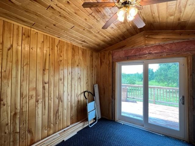 doorway with vaulted ceiling, wooden walls, carpet flooring, ceiling fan, and wooden ceiling