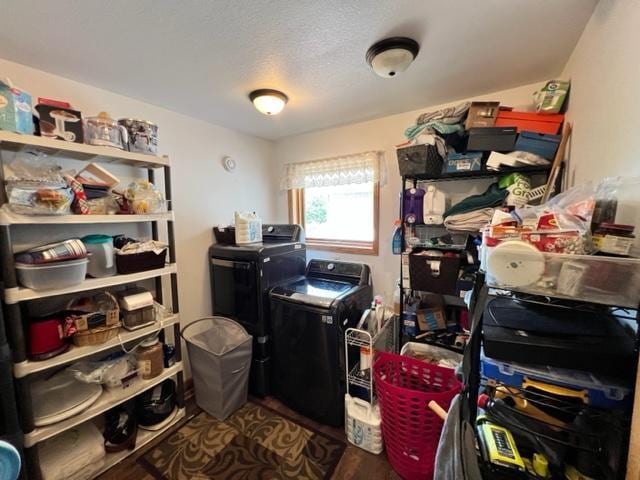 interior space with separate washer and dryer, dark wood-type flooring, and a textured ceiling