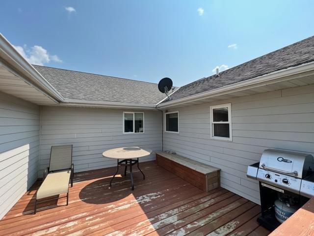 wooden terrace featuring area for grilling