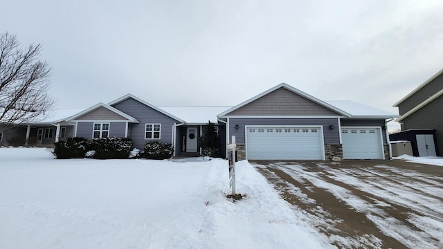 ranch-style home featuring a garage