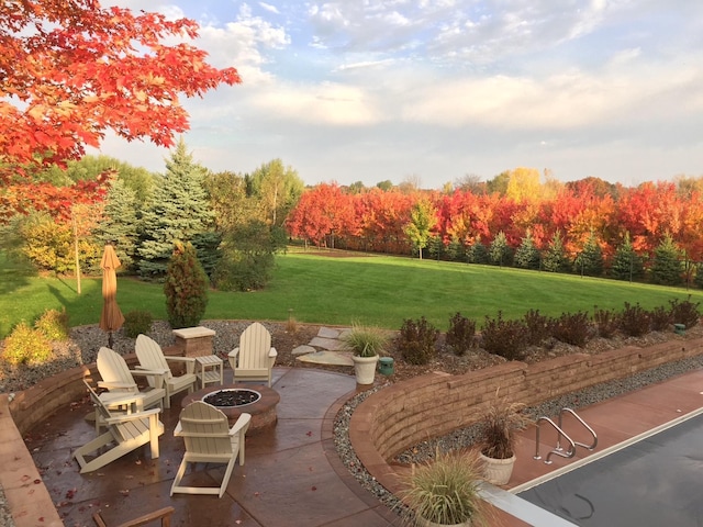 view of patio featuring an outdoor fire pit