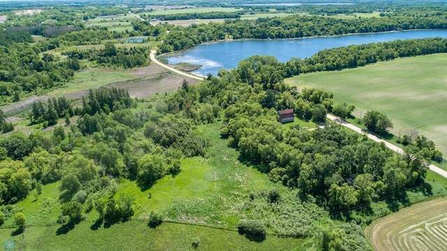 birds eye view of property featuring a water view and a rural view