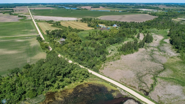 birds eye view of property with a rural view and a water view