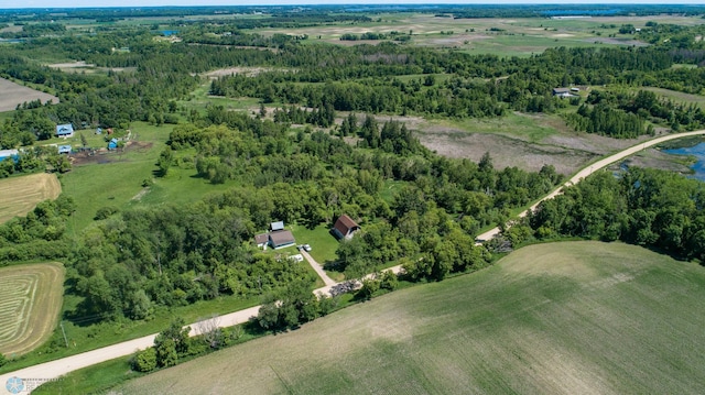 birds eye view of property with a rural view