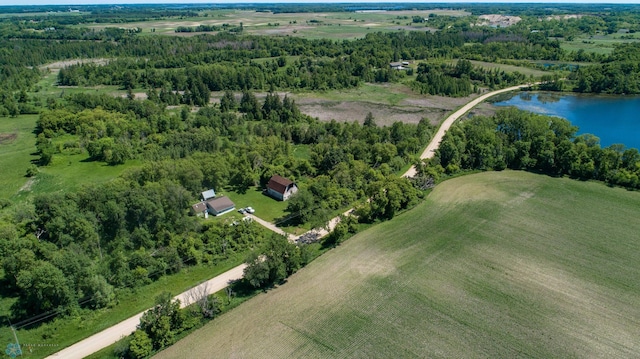 drone / aerial view with a water view and a rural view