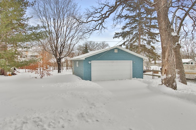 view of snow covered garage