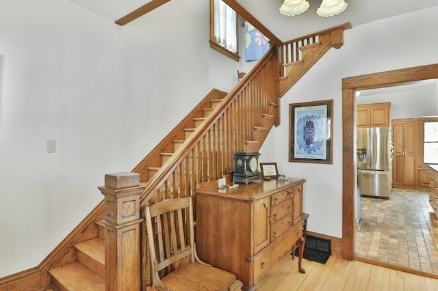 staircase featuring hardwood / wood-style flooring