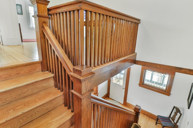 stairs featuring wood-type flooring