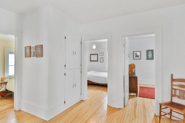 hallway with wood-type flooring